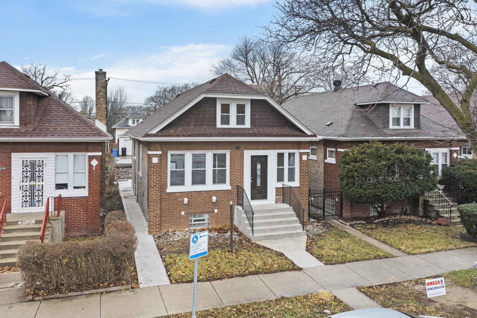 8946 South May Street Chicago, IL 60620 - Photo 1 of 23 a front view of a house with garden