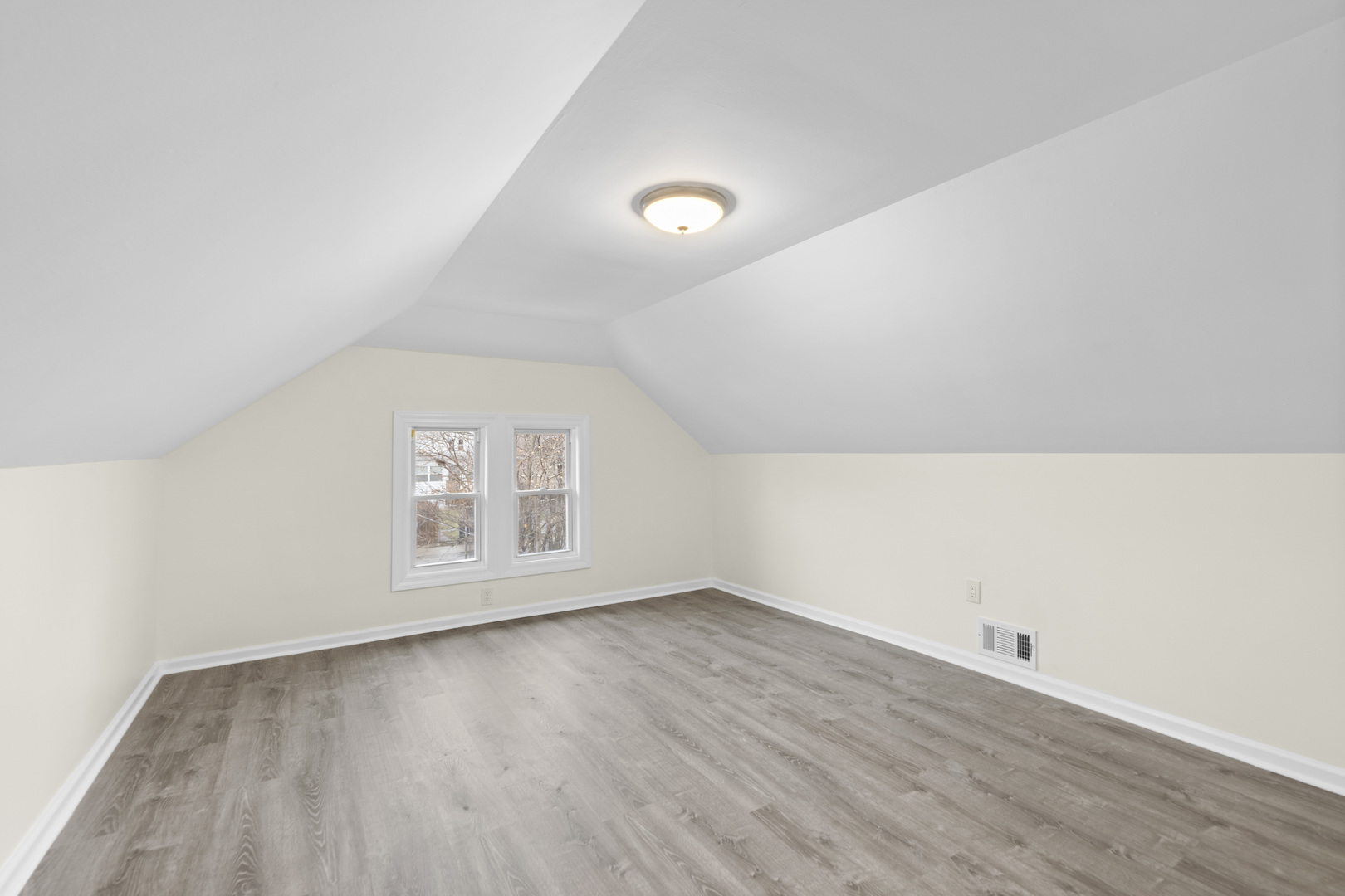 8946 South May Street Chicago, IL 60620 - Photo 11 of 23 an empty room with wooden floor and windows