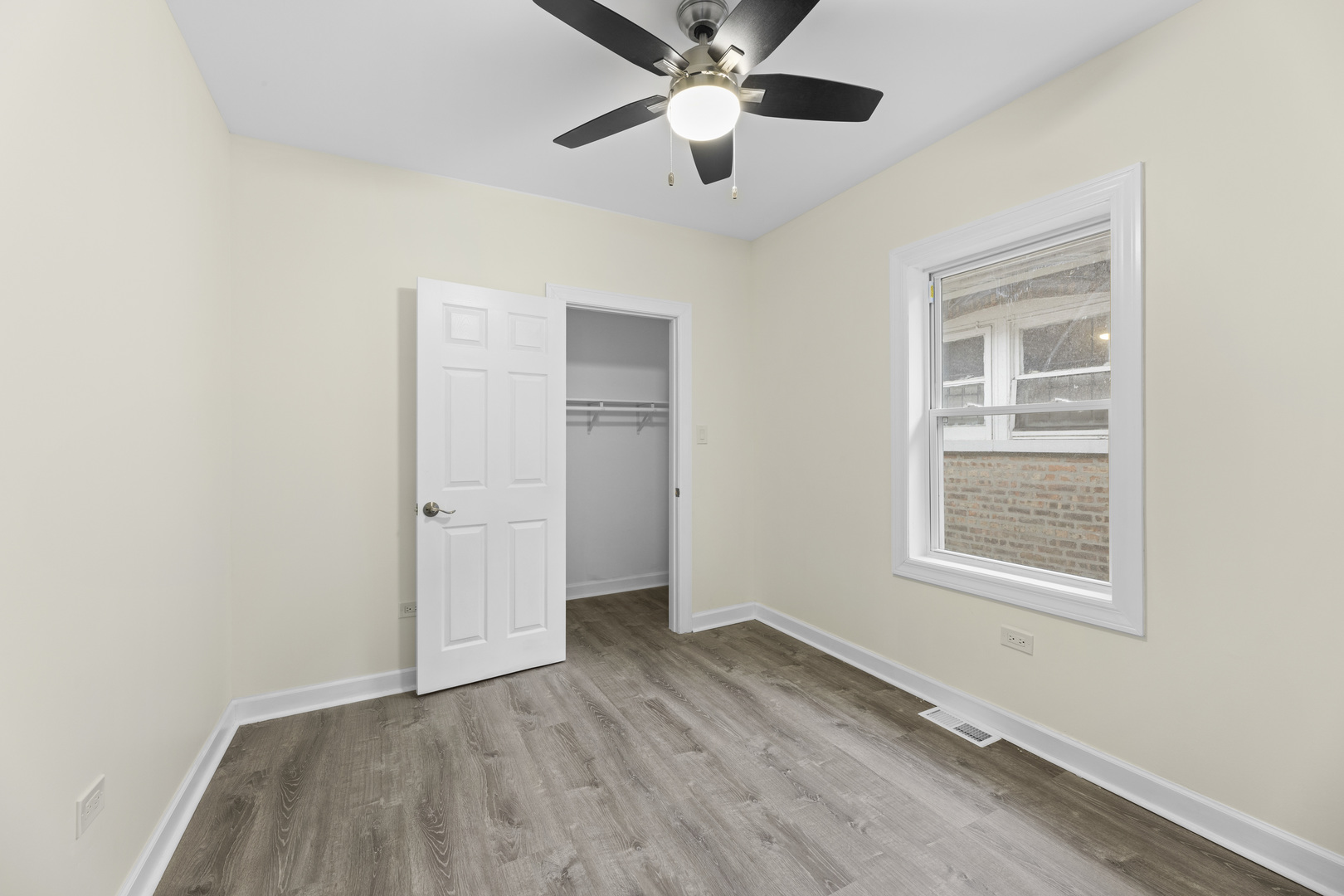 8946 South May Street Chicago, IL 60620 - Photo 14 of 23 a view of an empty room window and wooden floor