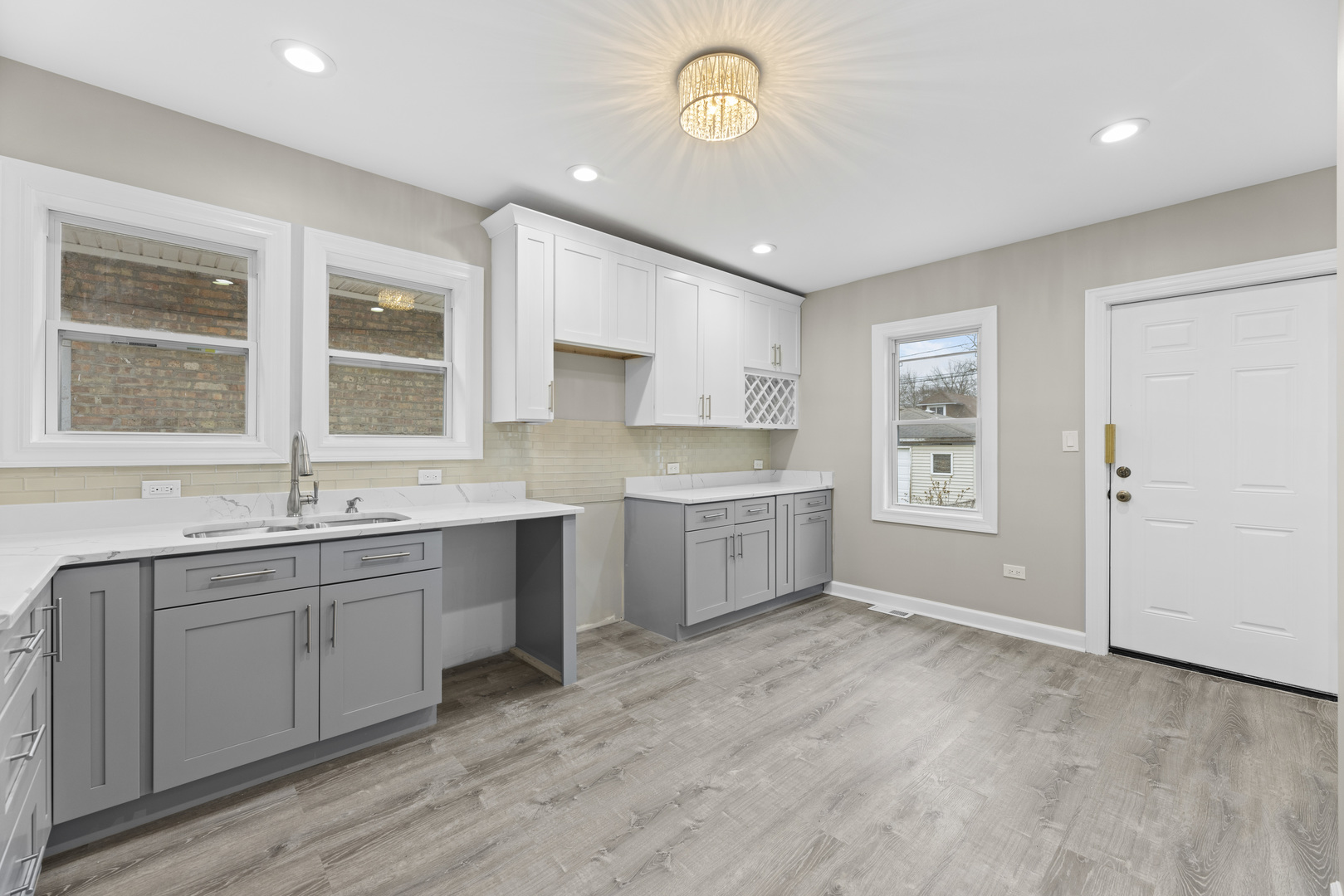 8946 South May Street Chicago, IL 60620 - Photo 16 of 23 a kitchen with a sink cabinets and window