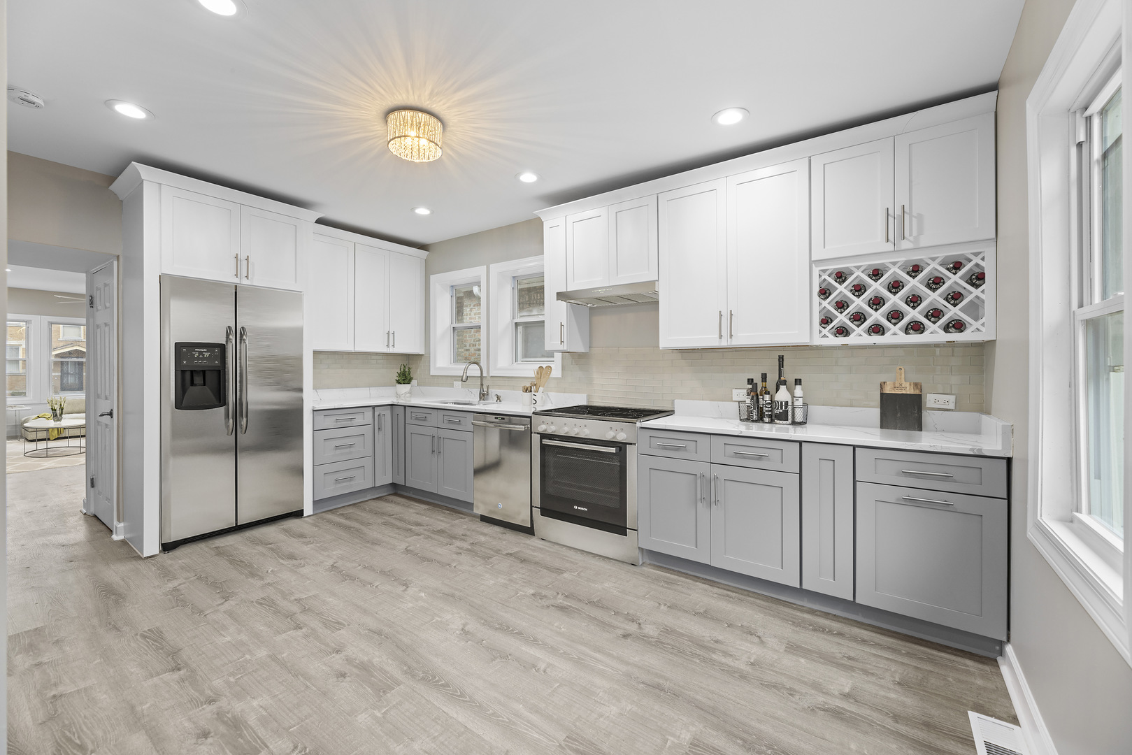 8946 South May Street Chicago, IL 60620 - Photo 4 of 23 a kitchen with white cabinets and white appliances