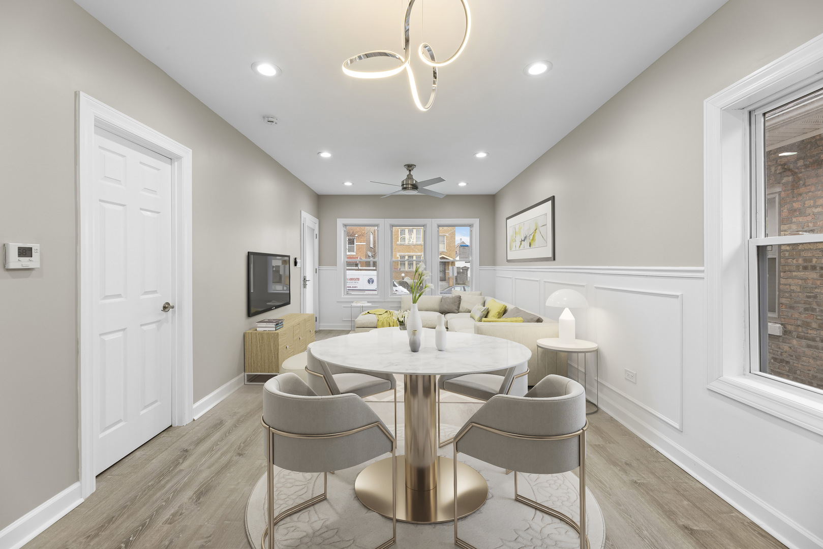 8946 South May Street Chicago, IL 60620 - Photo 5 of 23 a dining room with furniture a chandelier and wooden floor