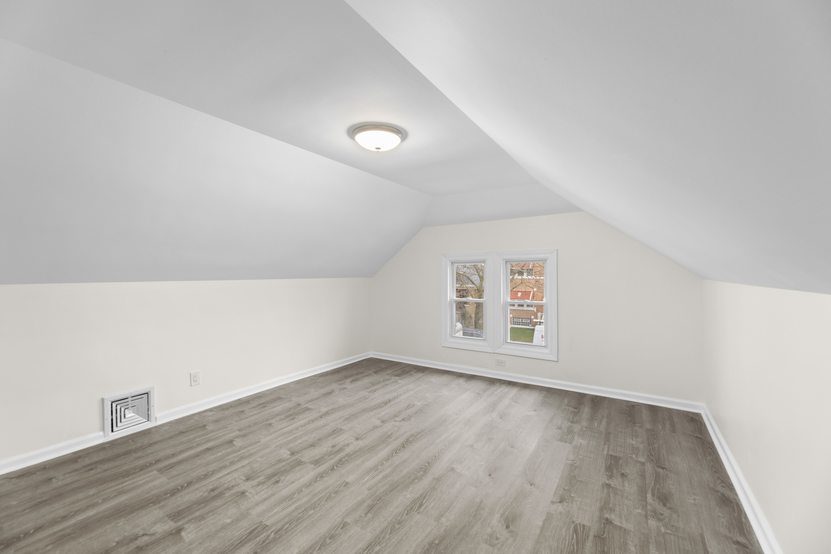 8946 South May Street Chicago, IL 60620 - Photo 10 of 23 an empty room with wooden floor and windows