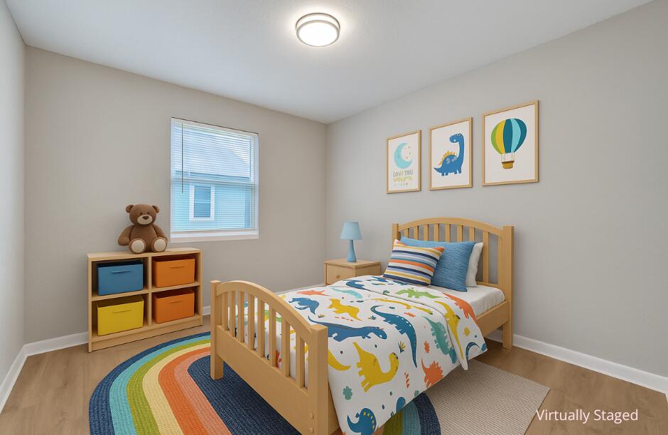 172 West 15th Street, Unit 1 Riviera Beach, FL 33404 - Photo 11 of 23 a bedroom with a bed and a window