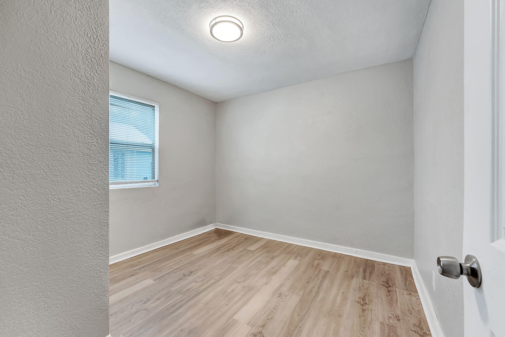 172 West 15th Street, Unit 1 Riviera Beach, FL 33404 - Photo 12 of 23 a view of a room with wooden floor