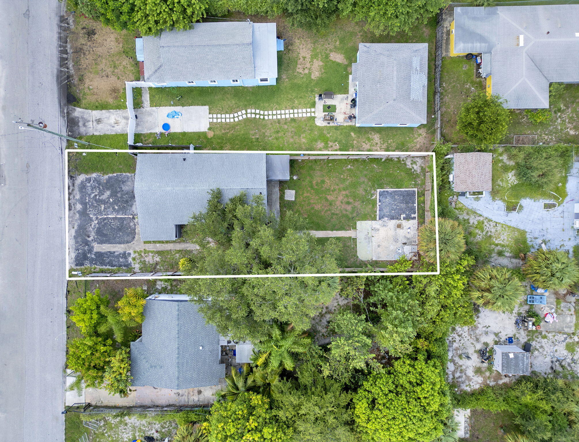 172 West 15th Street, Unit 1 Riviera Beach, FL 33404 - Photo 17 of 23 an aerial view of a house with a garden and a yard