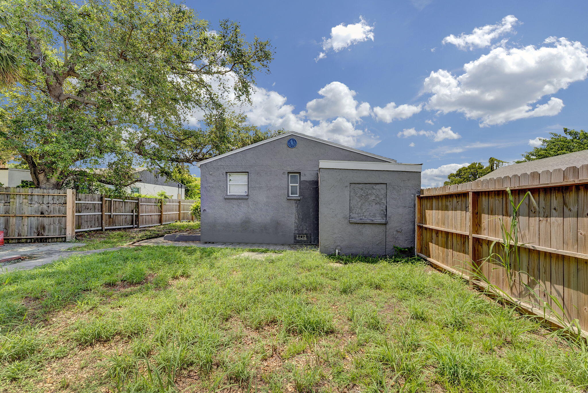 172 West 15th Street, Unit 1 Riviera Beach, FL 33404 - Photo 23 of 23 a house view with a garden space