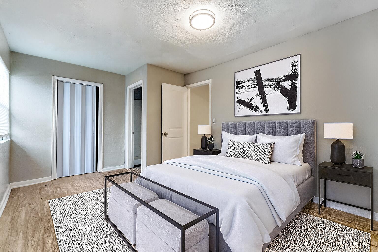 172 West 15th Street, Unit 1 Riviera Beach, FL 33404 - Photo 9 of 23 a bedroom with a bed and a painting on the wall