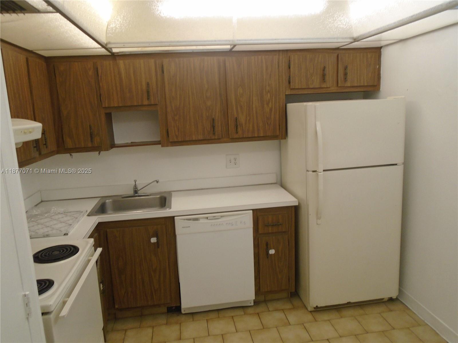 4174 Inverrary Drive, Unit 303 Lauderhill, FL 33319 - Photo 12 of 27 a utility room with dryer and washer