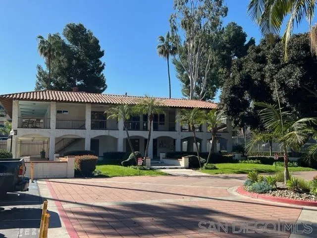 5989 Rancho Mission Road, Unit 201 San Diego, CA 92108 - Photo 1 of 14 a view of a house with a yard and sitting area