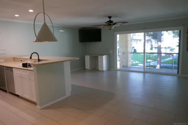 a kitchen with a sink and large window