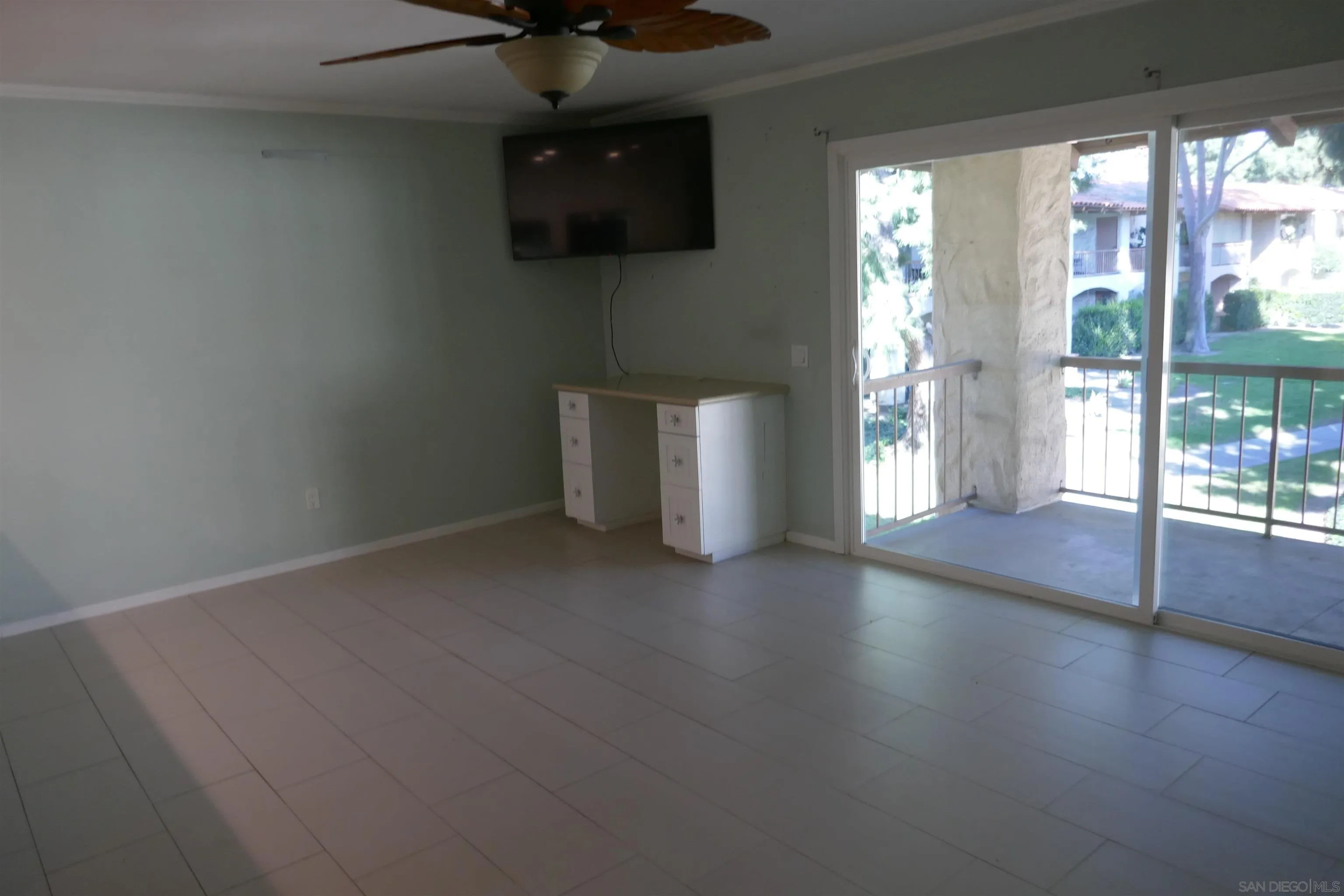 5989 Rancho Mission Road, Unit 201 San Diego, CA 92108 - Photo 7 of 14 a view of a livingroom with a flat screen tv