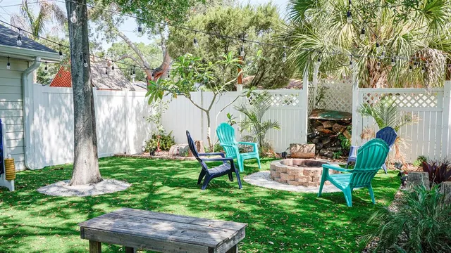 a view of outdoor sitting area with furniture and garden