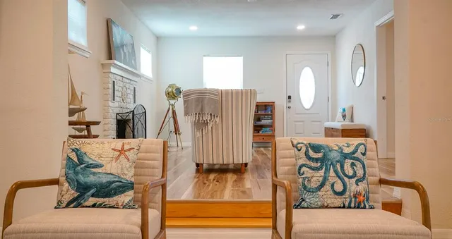 a living room with furniture and a large window