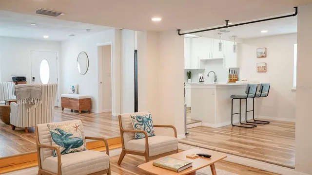 a bathroom with a bathtub a sink and a window