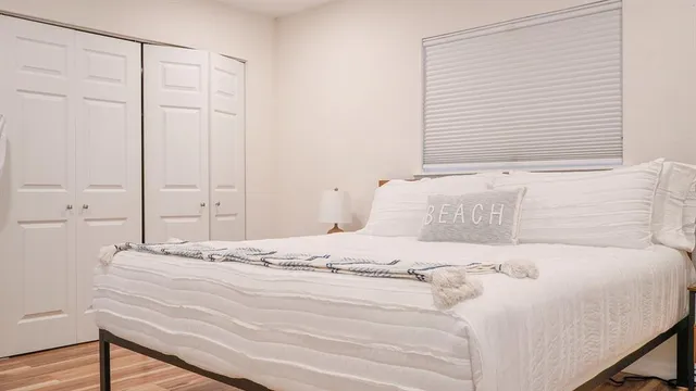 a backyard of a house with table and chairs