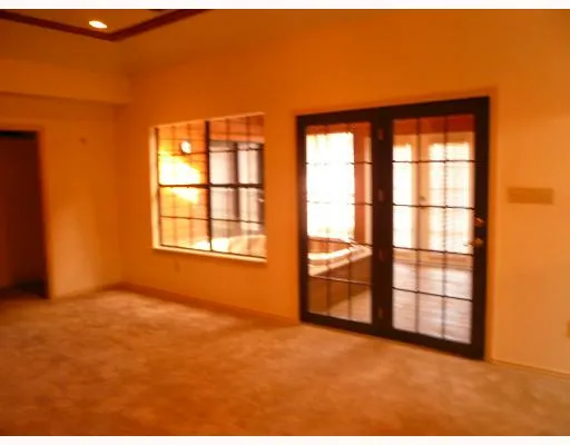 a view of empty room with windows