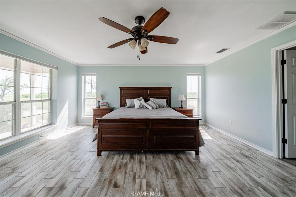 1869 Farm To Market Road 605 Hawley, TX 79525 - Photo 11 of 39 a bedroom with a bed and window