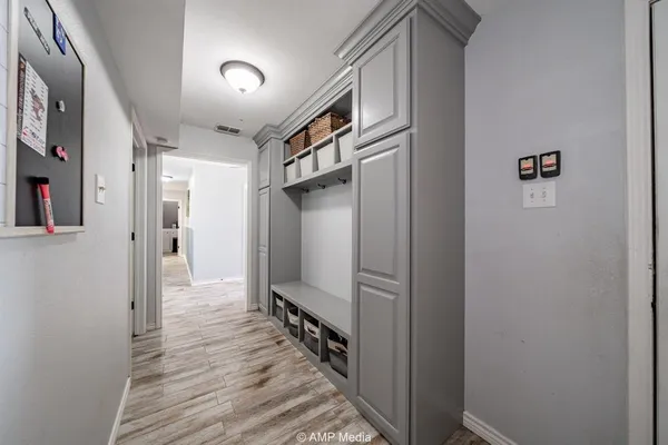 a view of hallway with wooden floor