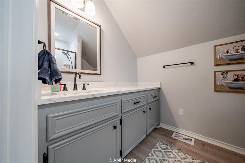 1869 Farm To Market Road 605 Hawley, TX 79525 - Photo 16 of 39 a bathroom with a sink and a mirror