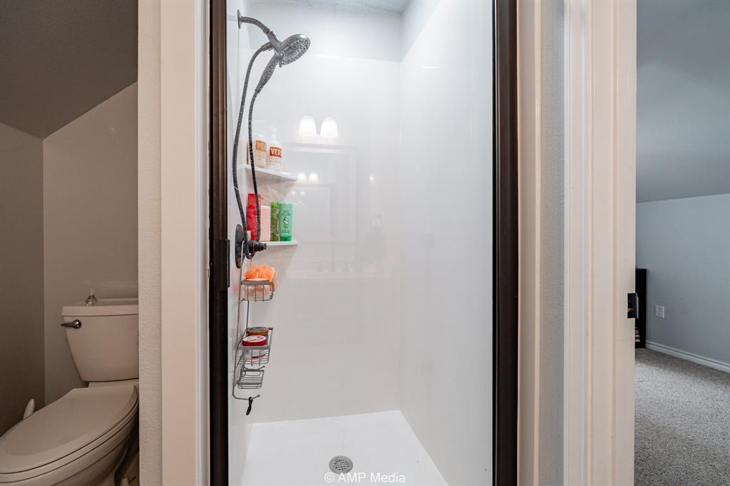 1869 Farm To Market Road 605 Hawley, TX 79525 - Photo 17 of 39 a bathroom with a toilet and a shower