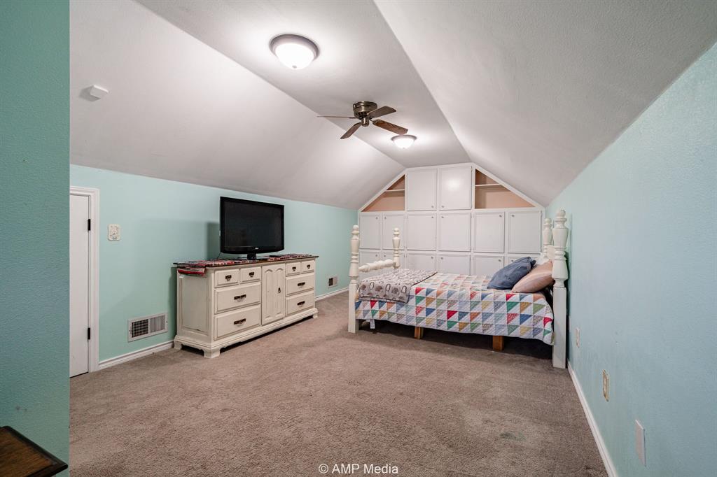 1869 Farm To Market Road 605 Hawley, TX 79525 - Photo 19 of 39 a bedroom with furniture and flat screen tv