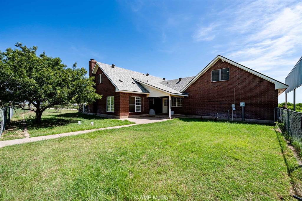 1869 Farm To Market Road 605 Hawley, TX 79525 - Photo 23 of 39 a front view of a house with a yard