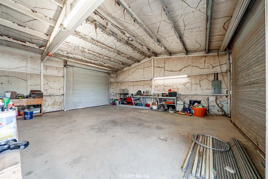 1869 Farm To Market Road 605 Hawley, TX 79525 - Photo 26 of 39 a view of parking garage with cars