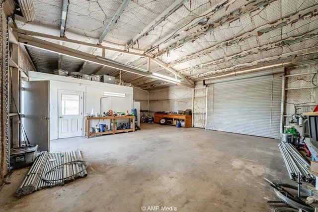 a backyard of a house with a yard and outdoor seating