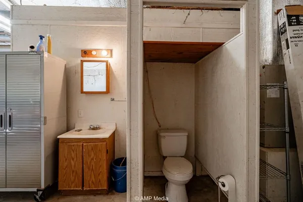 a bathroom with a toilet and a sink