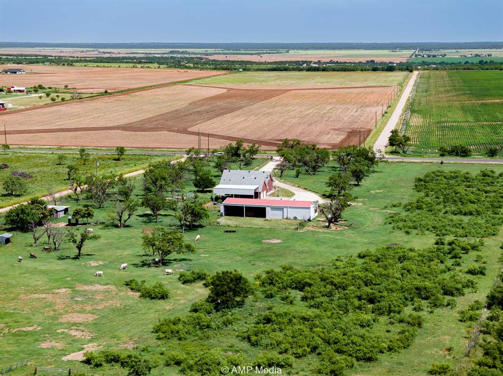 1869 Farm To Market Road 605 Hawley, TX 79525 - Photo 35 of 39 a backyard of a house with a yard and outdoor seating