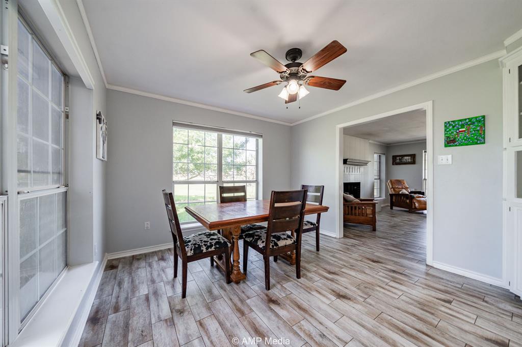 1869 Farm To Market Road 605 Hawley, TX 79525 - Photo 4 of 39 a view of a dining room with furniture and wooden floor