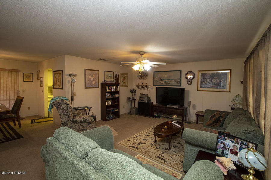 1011 Cherokee Ranch Road Holly Hill, FL 32117 - Photo 13 of 26 1011-Cherokee-Ranch-LivingRoom-Web_0338