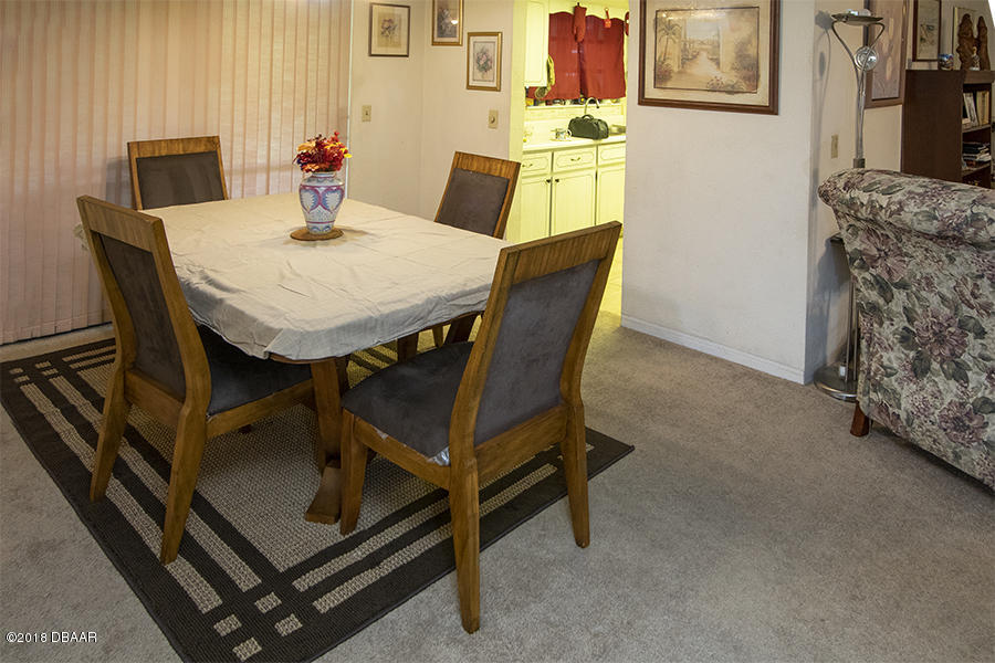 1011 Cherokee Ranch Road Holly Hill, FL 32117 - Photo 17 of 26 1011-Cherokee-Ranch-DiningRoom-Web_0373