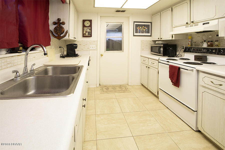 1011 Cherokee Ranch Road Holly Hill, FL 32117 - Photo 19 of 26 1011-Cherokee-Ranch-Kitchen-Web_0381
