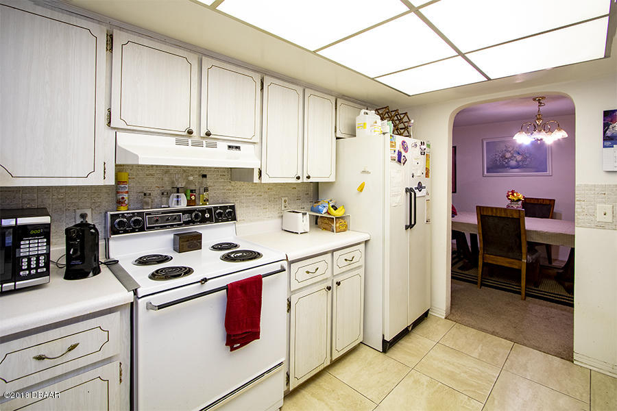 1011 Cherokee Ranch Road Holly Hill, FL 32117 - Photo 20 of 26 1011-Cherokee-Ranch-Kitchen-Web_0385