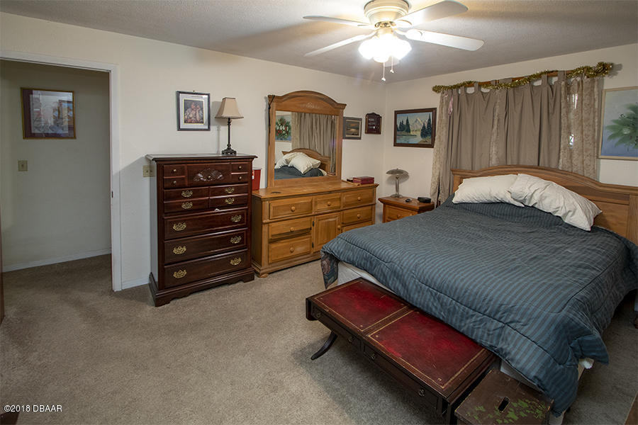 1011 Cherokee Ranch Road Holly Hill, FL 32117 - Photo 23 of 26 1011-Cherokee-Ranch-BedRoom-Web_0360