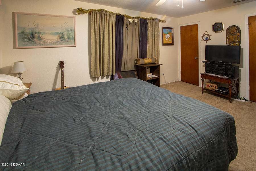 1011 Cherokee Ranch Road Holly Hill, FL 32117 - Photo 24 of 26 1011-Cherokee-Ranch-BedRoom-Web_0355