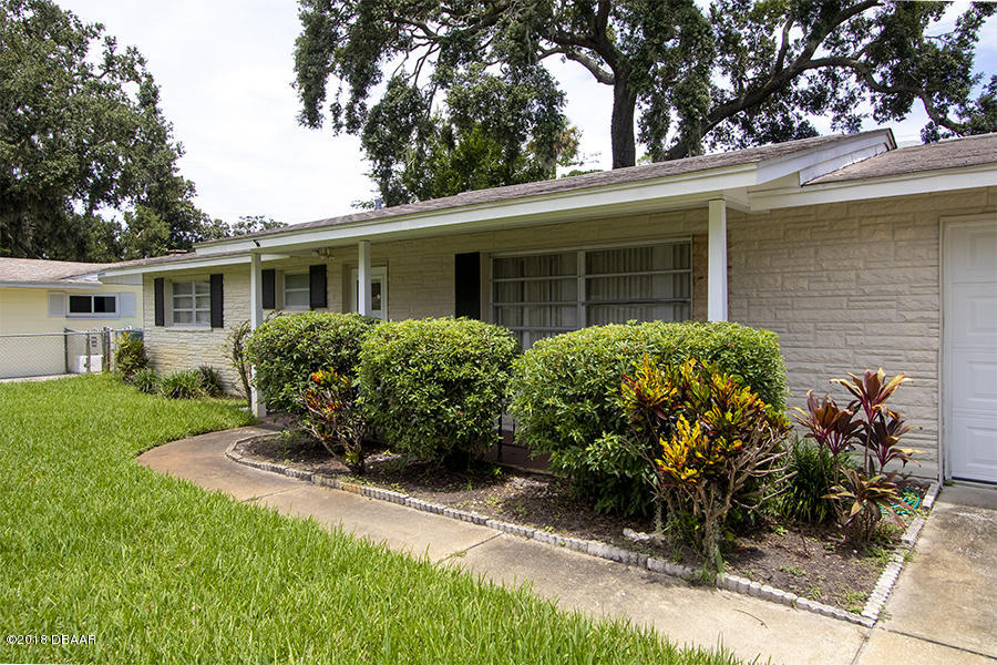 1011 Cherokee Ranch Road Holly Hill, FL 32117 - Photo 7 of 26 1011-Cherokee-Ranch-Exterior-Front-Web_0