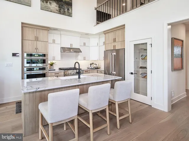 a dining table with chairs and wooden floor