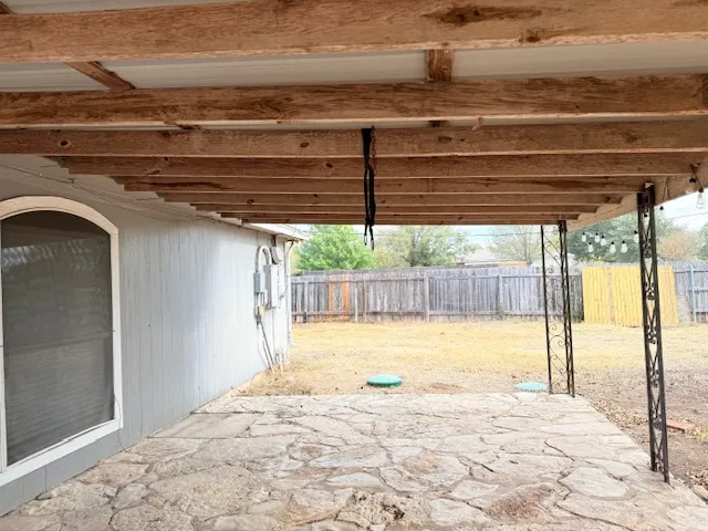 a view of a backyard of the house