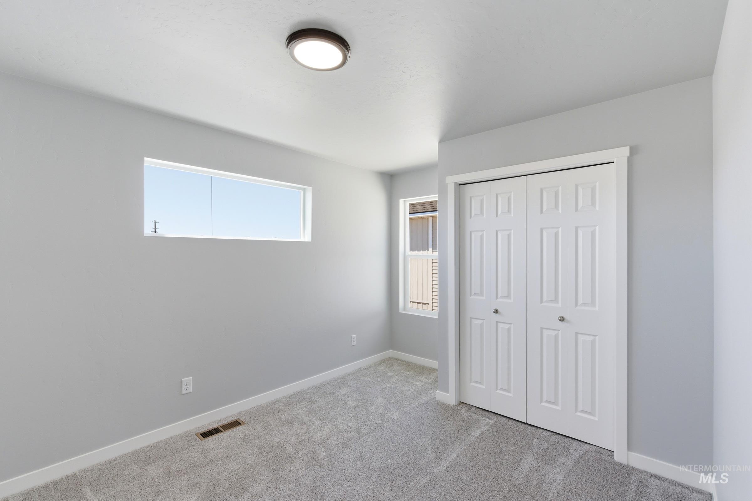 2374 West Fallon Loop Nampa, ID 83651 - Photo 16 of 24 Light gray walls complement the new gray carpeting