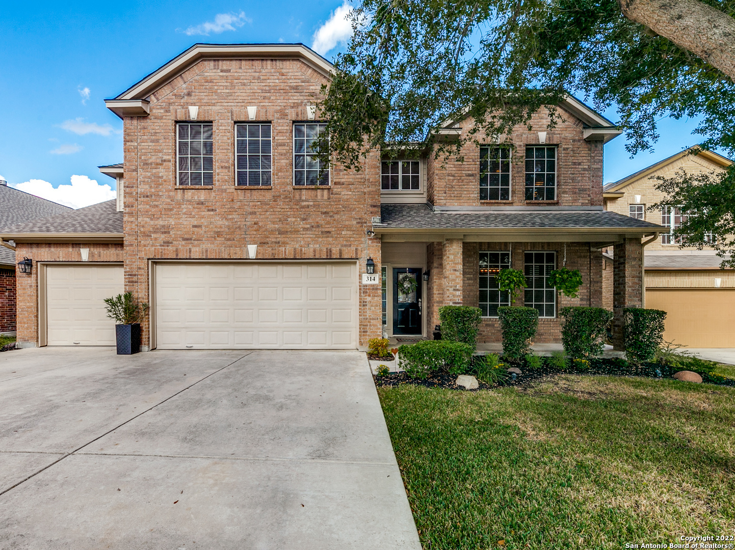 314 Cascade Cove Cibolo, TX 78108 - Photo 1 of 1 a front view of a house with a yard and garage
