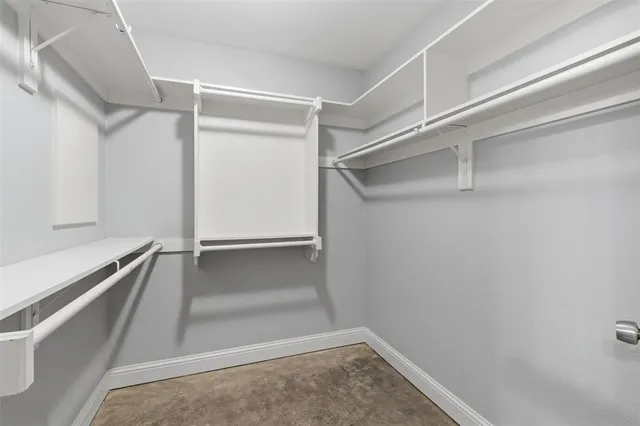 a view of an empty walk in closet