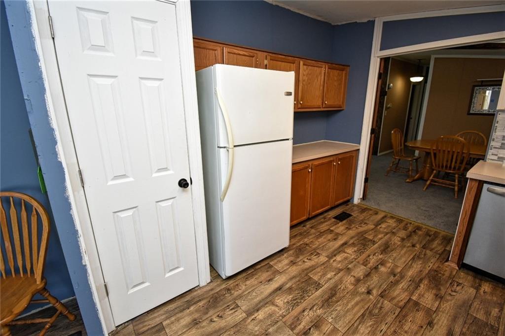 1041 Barr Run Road Marianna, PA 15345 - Photo 14 of 32 a view of a refrigerator a storage and utility room with wooden floor