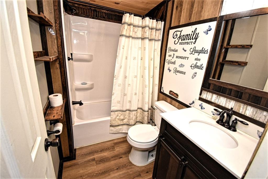 1041 Barr Run Road Marianna, PA 15345 - Photo 29 of 32 a bathroom with a sink a toilet a mirror and a shower