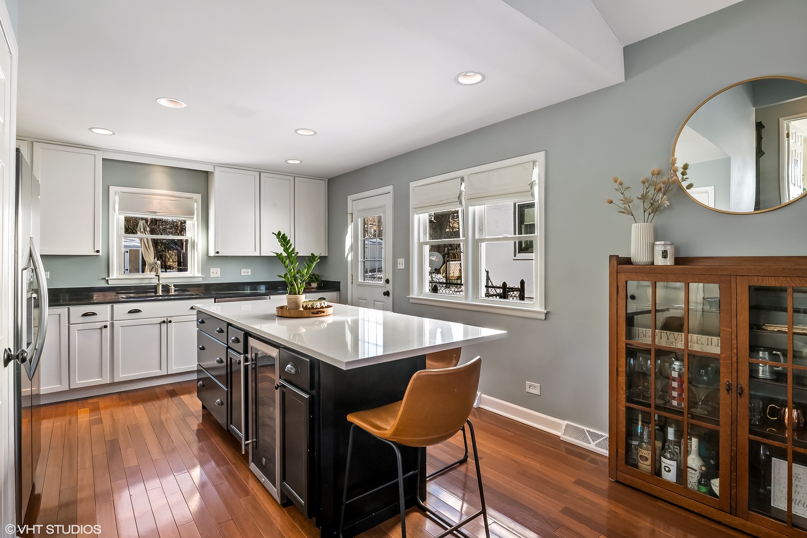 637 Second Avenue Libertyville, IL 60048 - Photo 8 of 22 a kitchen with stainless steel appliances granite countertop a stove a sink dishwasher and a refrigerator with wooden floor