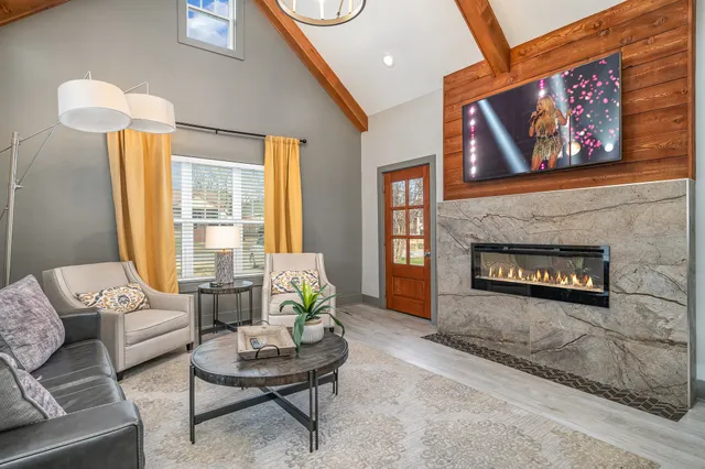 a living room with furniture and a fireplace