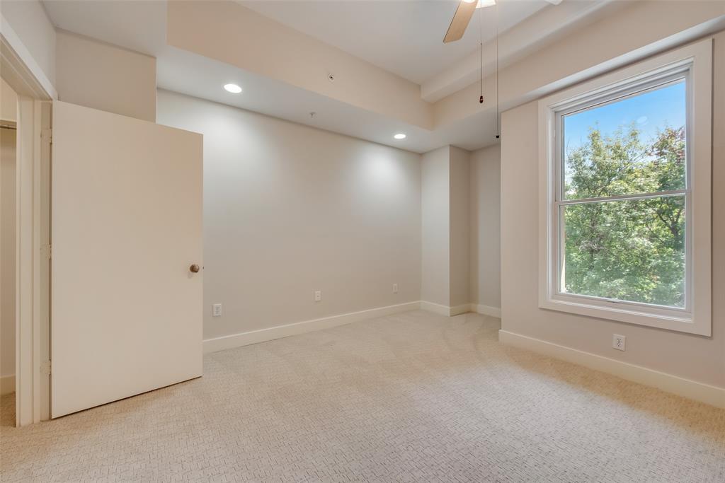 5055 Addison Circle, Unit 407 Addison, TX 75001 - Photo 4 of 22 Secondary Bedroom / Office Window has View of Pool and Gardens