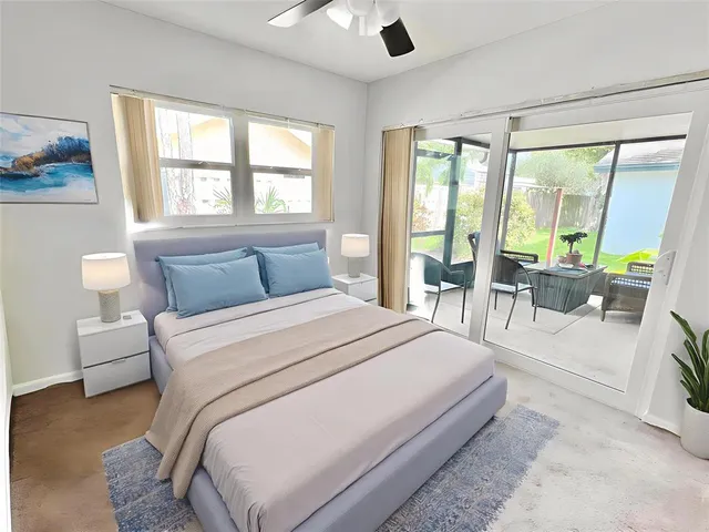 a large bedroom with a large bed and a large window